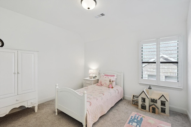 bedroom with light carpet and vaulted ceiling