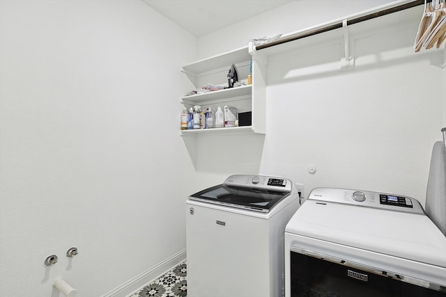 clothes washing area with independent washer and dryer