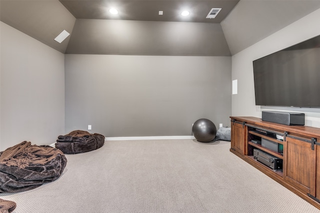 interior space with carpet and vaulted ceiling