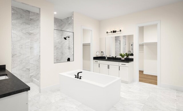 bathroom featuring vanity and shower with separate bathtub