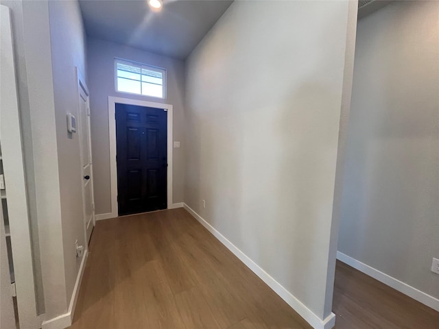 doorway to outside with wood-type flooring