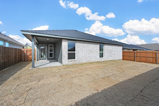 rear view of property with a patio area