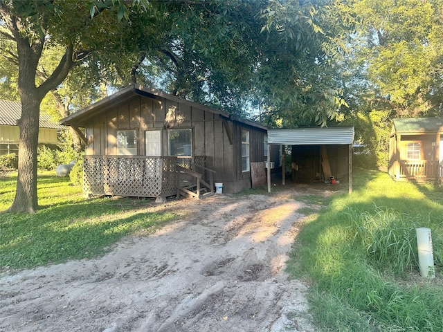 view of outbuilding with a yard