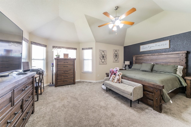 carpeted bedroom with vaulted ceiling and ceiling fan