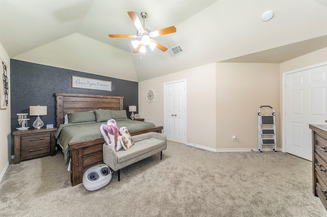 bedroom with vaulted ceiling, ceiling fan, and light colored carpet