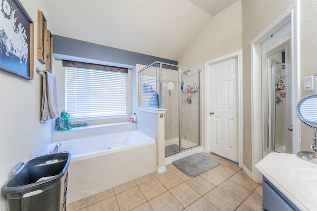 bathroom featuring tile patterned flooring, shower with separate bathtub, lofted ceiling, and vanity