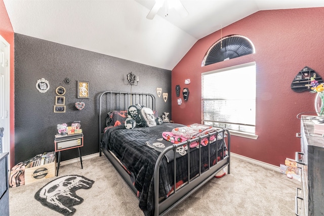 bedroom with ceiling fan, light colored carpet, and vaulted ceiling