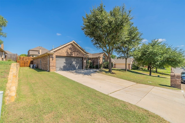 view of front of home with cooling unit, a front yard, and a garage