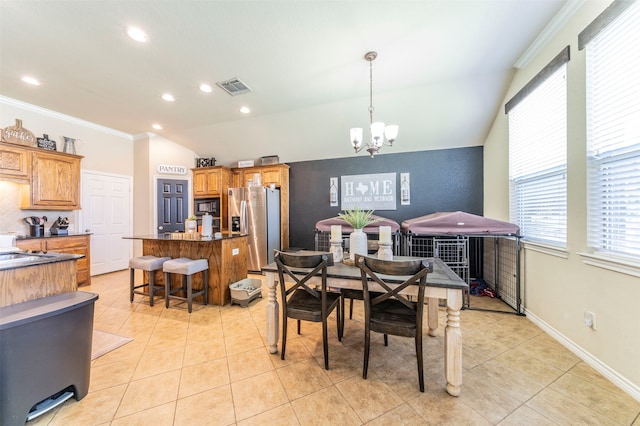 tiled dining space with crown molding, lofted ceiling, and a notable chandelier