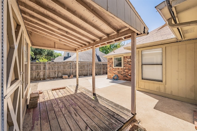 wooden deck with a patio area