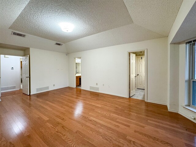 bathroom with toilet, an enclosed shower, and tile patterned floors