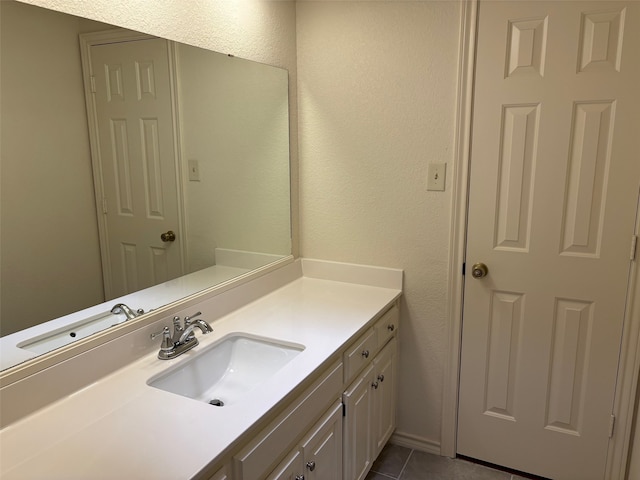 bathroom featuring vanity and tile patterned flooring