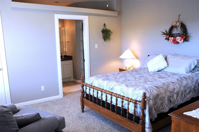 carpeted bedroom featuring connected bathroom