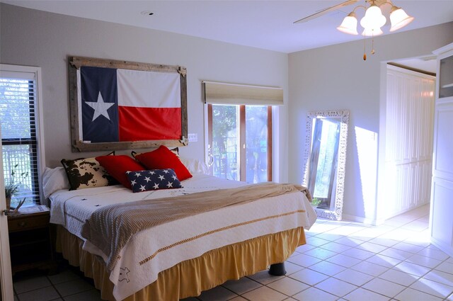 carpeted bedroom with connected bathroom and baseboards