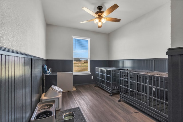 bedroom with ceiling fan and dark wood-type flooring