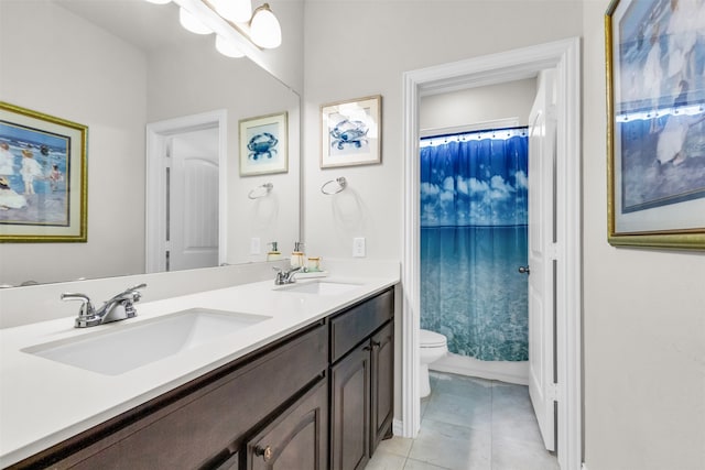 full bathroom with tile patterned flooring, shower / bath combination with curtain, vanity, and toilet