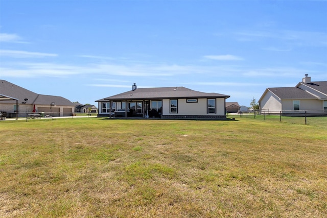 back of house with a yard