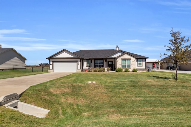 ranch-style house featuring a front yard and a garage