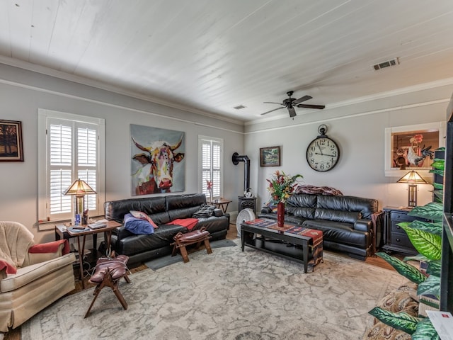 living room with crown molding and ceiling fan