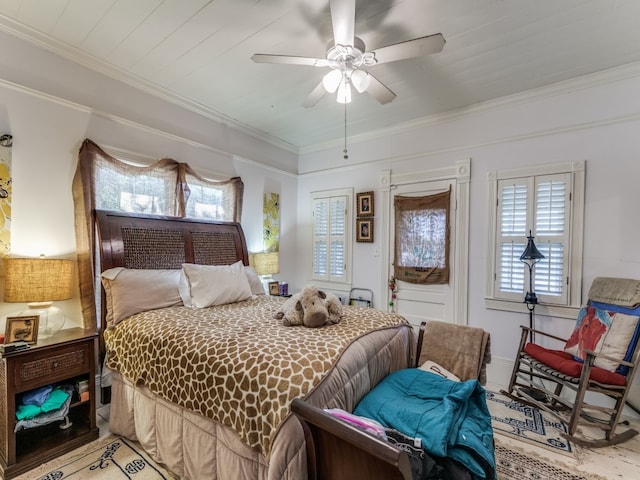 bedroom with crown molding and ceiling fan