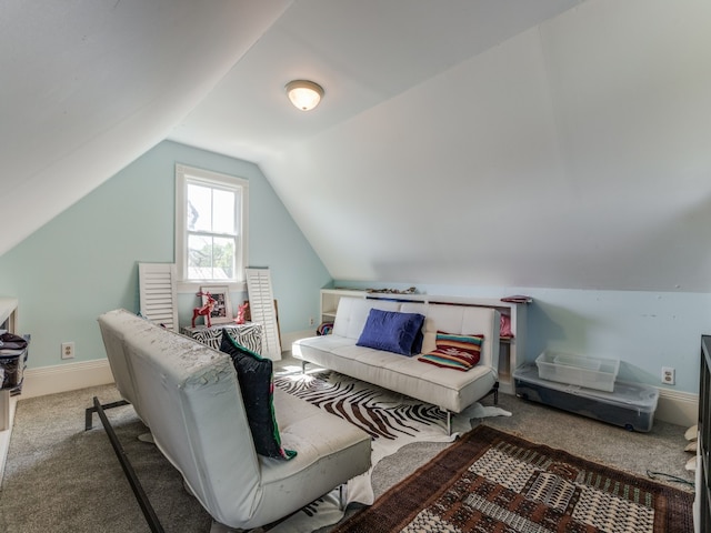 bedroom with carpet and lofted ceiling