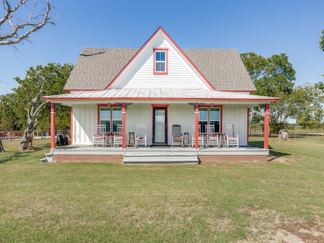 back of property with a lawn