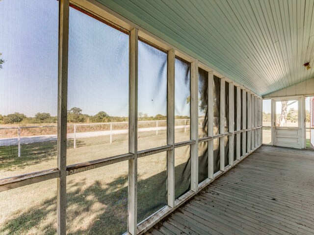 unfurnished sunroom with lofted ceiling and wooden ceiling