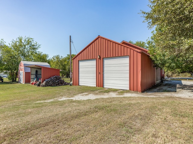 garage with a yard