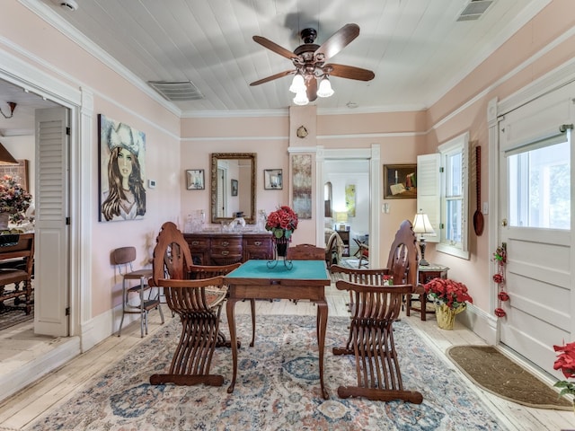 dining room featuring ceiling fan, light wood-type flooring, ornamental molding, and wood ceiling