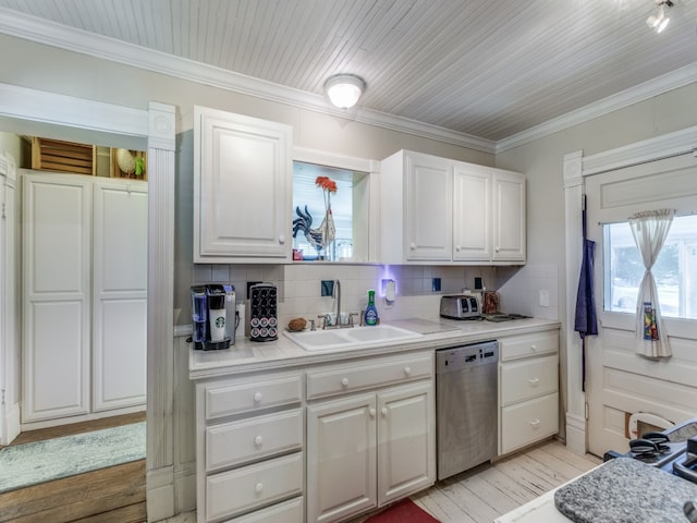 kitchen featuring light hardwood / wood-style floors, stainless steel dishwasher, sink, and white cabinets