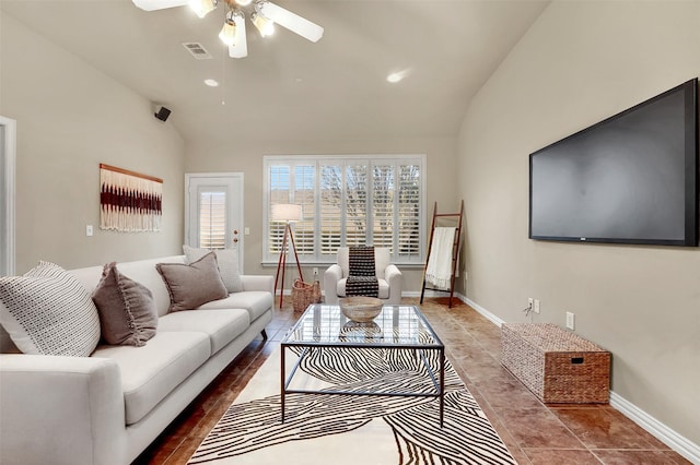 tiled living room featuring vaulted ceiling and ceiling fan