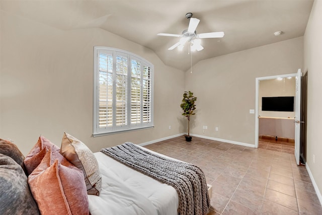 bedroom with vaulted ceiling, light tile patterned floors, and ceiling fan