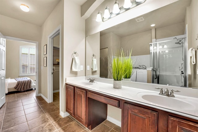 bathroom with vanity, an enclosed shower, and tile patterned floors