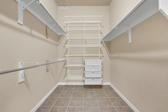 walk in closet featuring light tile patterned floors