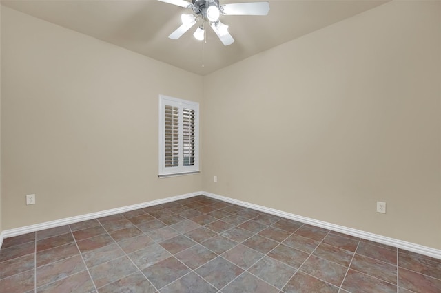 empty room with tile patterned floors and ceiling fan