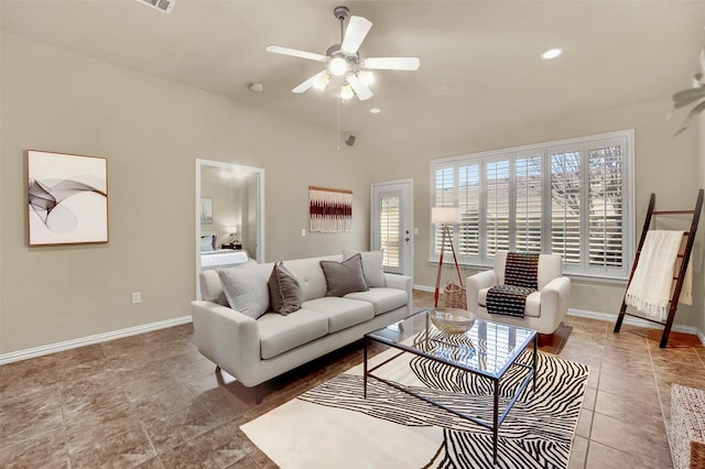 living room featuring ceiling fan and tile patterned floors