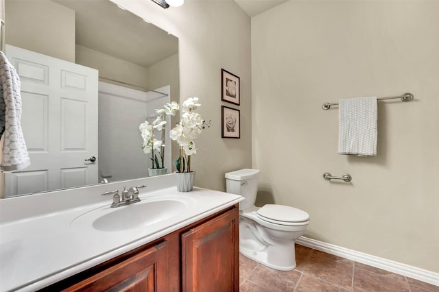 bathroom with vanity, tile patterned floors, and toilet