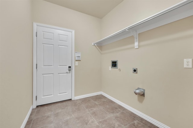 washroom featuring hookup for an electric dryer, washer hookup, and light tile patterned floors