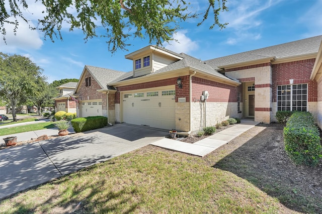 view of front of house featuring a garage and a front yard