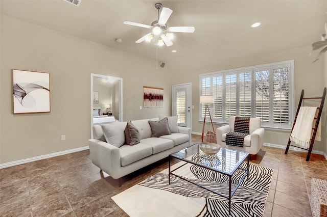 living room featuring tile patterned flooring, lofted ceiling, and ceiling fan