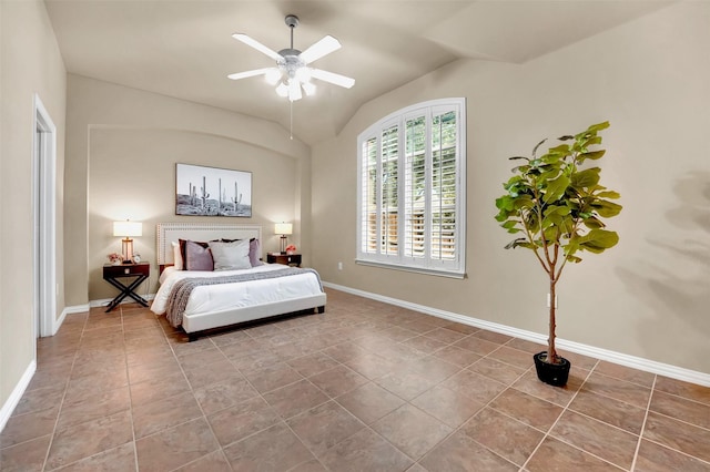 tiled bedroom featuring vaulted ceiling and ceiling fan