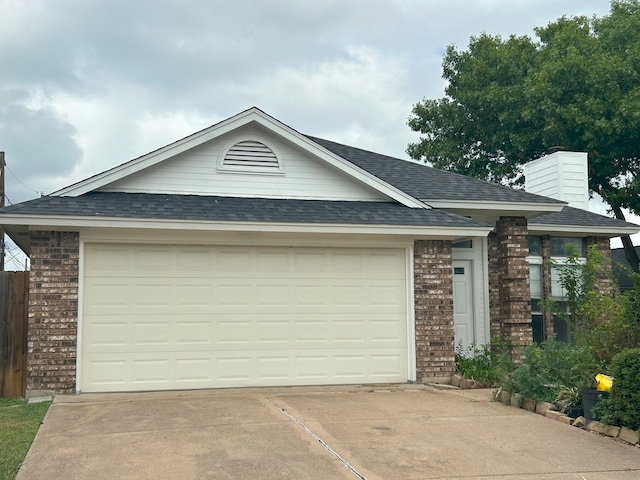 ranch-style home featuring a garage