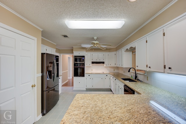 kitchen featuring ceiling fan, sink, white cabinetry, stainless steel appliances, and crown molding