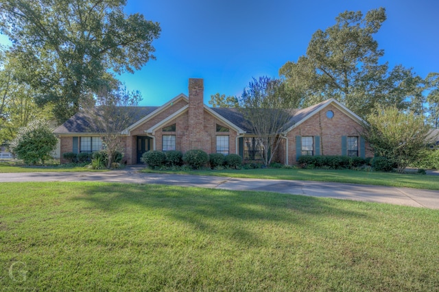 single story home with a front yard