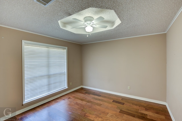 empty room featuring a textured ceiling, crown molding, ceiling fan, and hardwood / wood-style flooring