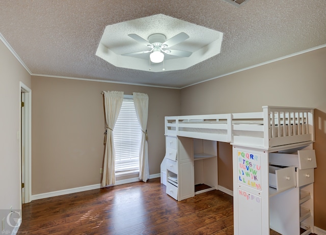 unfurnished bedroom with a textured ceiling, ornamental molding, ceiling fan, and dark wood-type flooring