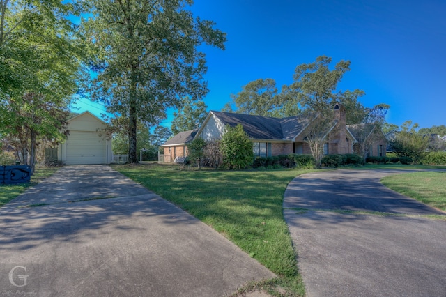 ranch-style home with a garage and a front yard