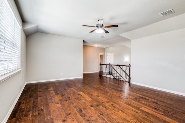 empty room with ceiling fan and dark hardwood / wood-style floors