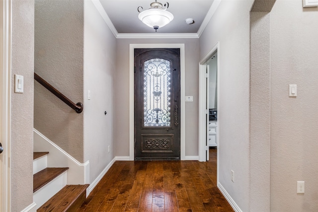 entryway with crown molding and dark hardwood / wood-style floors