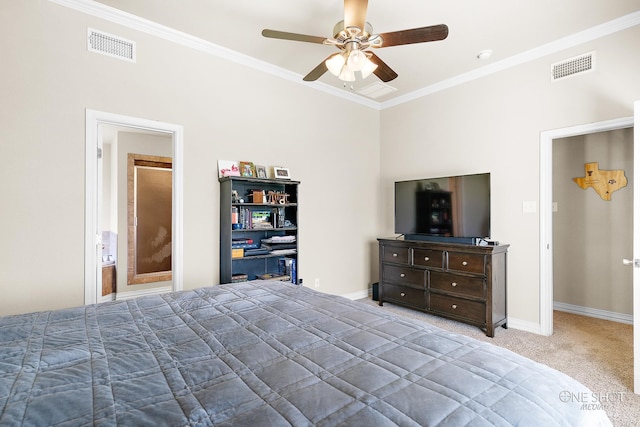 bedroom featuring ornamental molding, connected bathroom, ceiling fan, and carpet floors